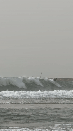 Dense fog shrouds Tel Aviv coastline amid rough seas