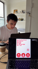 Person works on laptop in leather chair in New York