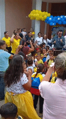 Venezuelan school children gather for outdoor ceremony with traditional dancing