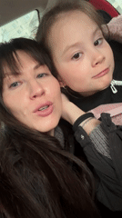 Mother and daughter record video in car in Perm