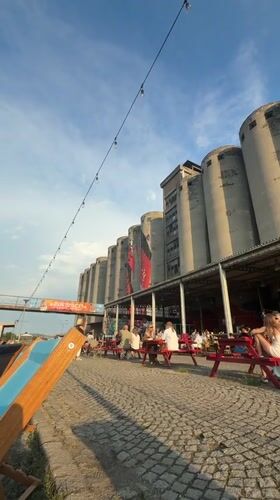 Aperol, deck chairs, and murals at Beton Hala