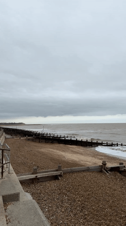 Cloudy day at East Suffolk beach with choppy seas