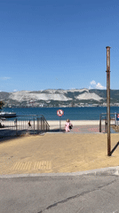 Novorossiysk embankment on a clear summer afternoon