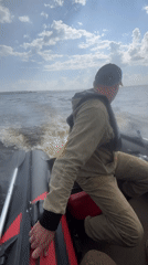 Fishing trip on a choppy lake near Chaikovsky, Russia