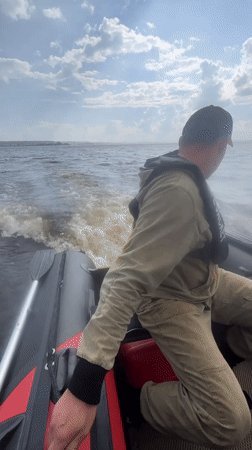 Fishing trip on a choppy lake near Chaikovsky, Russia