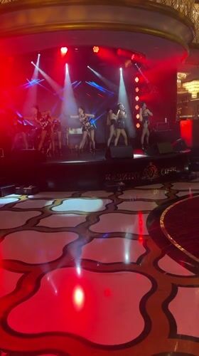 Masked stage performance and prize draw at Estosadok casino venue