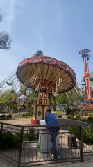 Tourist visits Sochi attractions, documents amusement park and oceanarium