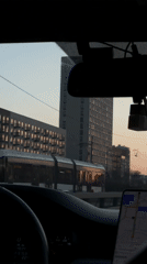 Moscow street scene captured showing tram and buildings at dusk