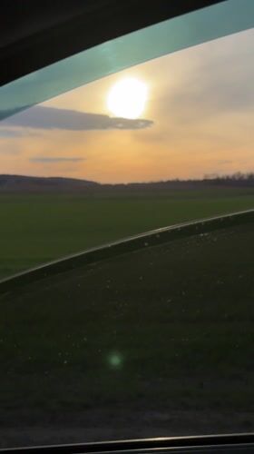 Sunset drive captured through rural Russian countryside near Starye Chuti