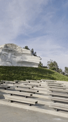 Hillside face sculpture and amphitheater documented in Arseniev, Russia