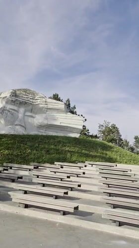 Hillside face sculpture and amphitheater documented in Arseniev, Russia