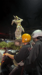 Motorcyclists stop at traffic light in Kuta Selatan