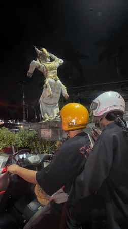 Motorcyclists stop at traffic light in Kuta Selatan