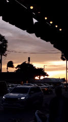 Sunset street scene captured from covered vantage in Pattaya