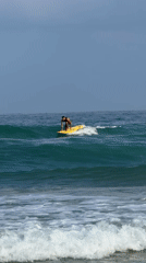 Surfing and paddleboarding on a Bat Yam morning