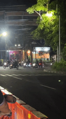 Night ride through Denpasar's busy roundabout streets