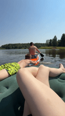 Paddleboarding and floating on a calm Russian lake