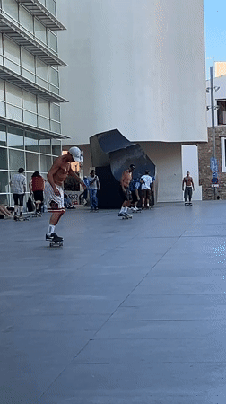 Barcelona Pride parade meets street skating on a sunny afternoon