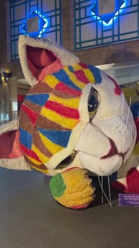 Jakarta restaurant venue features colorful cat sculpture, dining ambiance