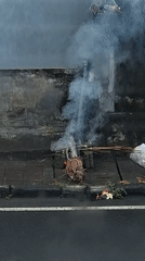 Roadside ritual burning and offerings in Blahbatuh, Bali