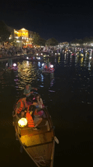 Lantern boats drift the Thu Bon River in Hoi An at night