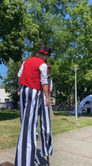 Street performers and activities at a summer fair in Buk, Poland