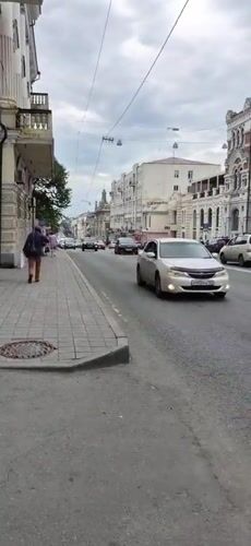 Street-level scenes through Vladivostok's city center on a grey morning