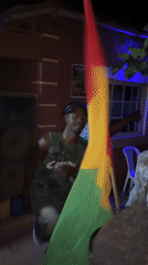 Nighttime gathering features dancing, flag-waving in Kuru Karama, Nigeria