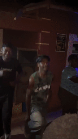 Nighttime gathering features dancing, flag-waving in Kuru Karama, Nigeria