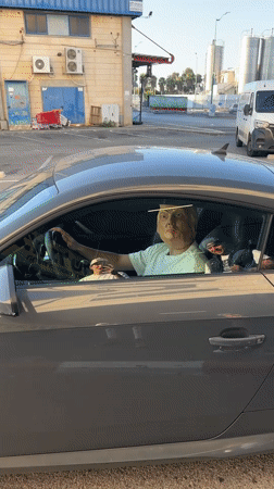 Trump mask in a parked Audi, ice hockey nearby in Tnuvot