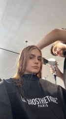 Woman documents complete hair transformation session at Tbilisi salon