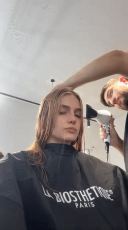 Woman documents complete hair transformation session at Tbilisi salon