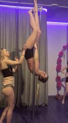 Women practice pole dancing at Batumi fitness studio