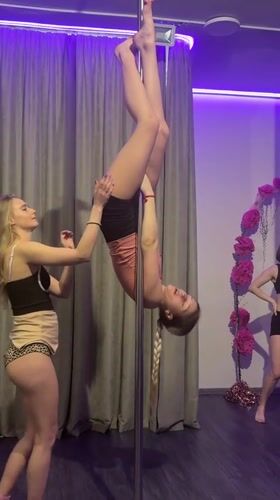 Women practice pole dancing at Batumi fitness studio