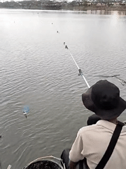 Fishermen gather at Lhokseumawe waterfront on overcast morning