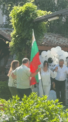 Traditional folk dance celebration with Bulgarian flag in Varna