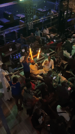 Nightclub gathering with DJ performance captured in Obosi, Nigeria