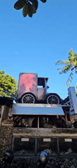 Vintage-themed coffee shop displays antique car, bicycle clocks in Denpasar