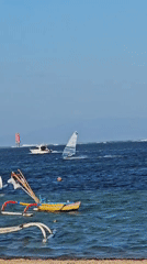 Galungan day on Bali's coast: ceremony meets water sports