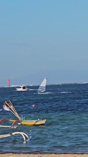 Galungan day on Bali's coast: ceremony meets water sports