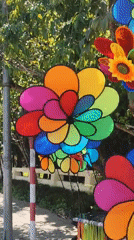 Colorful pinwheel vendor cart spotted on Đà Lạt sidewalk