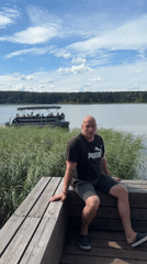 Lakeside afternoon in Votkinsk, pontoon boat in the distance