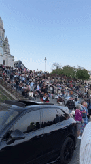 Evening crowds gather at Paris viewing spot