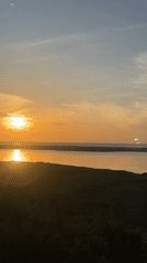 Golden sunset over Arugam Bay's calm coastal waters