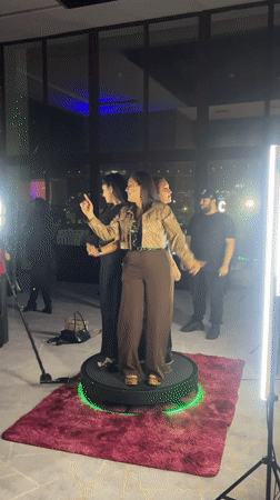 360-degree video booth moment at a lit-up event in Arica