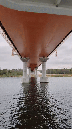 Orange bridge documented from water level in Russian river region