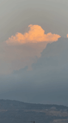 Warm clouds roll over Karmiel at golden hour
