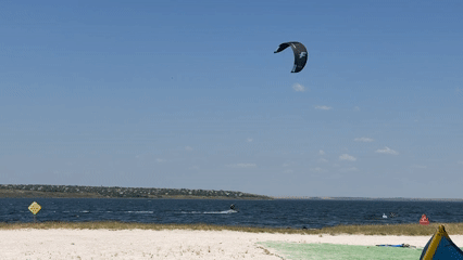 Kiteboarding on a sunny summer morning near Ukrainka