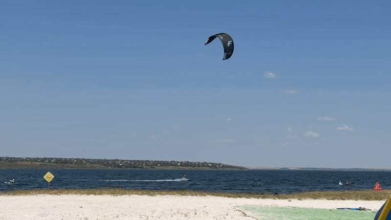 Kiteboarding on a sunny summer morning near Ukrainka
