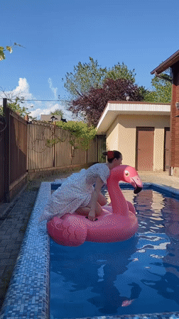 Women enjoy sunny afternoon at residential pool in Dagomys